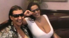 Stacked BFFs Aneta Buena and Kora roam around town with their tits exposed and stop to piss in the sea