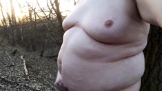 Chubby masturbates in the woods